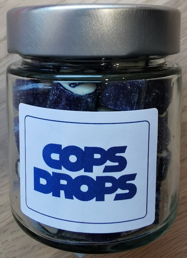 a glass of COPS-DROPS